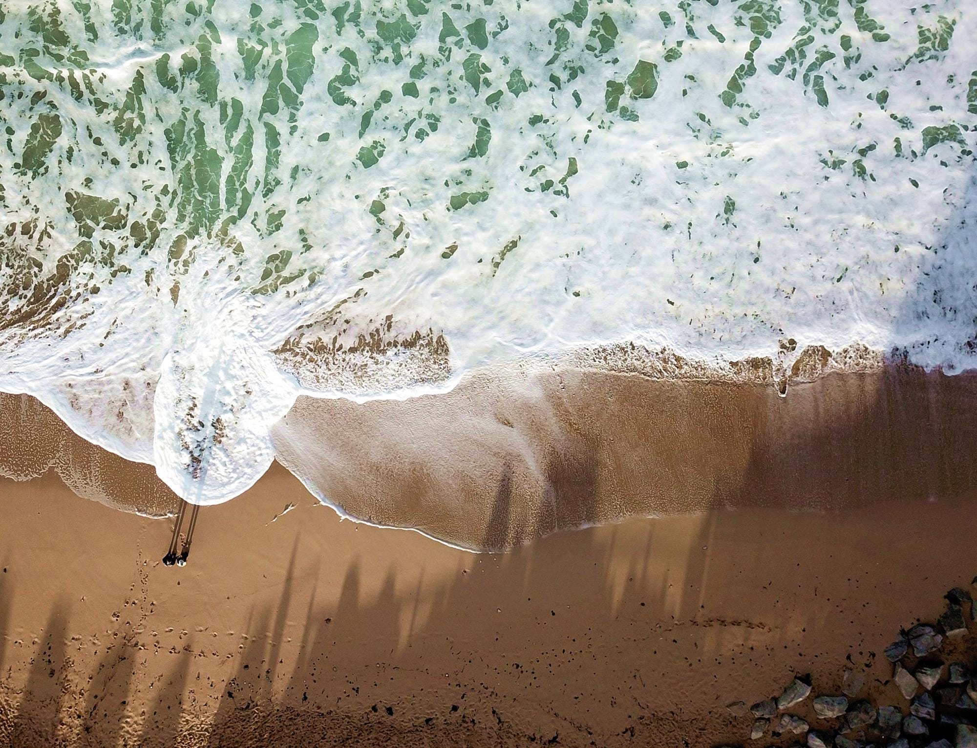 Drone image of waves breaking on a beach