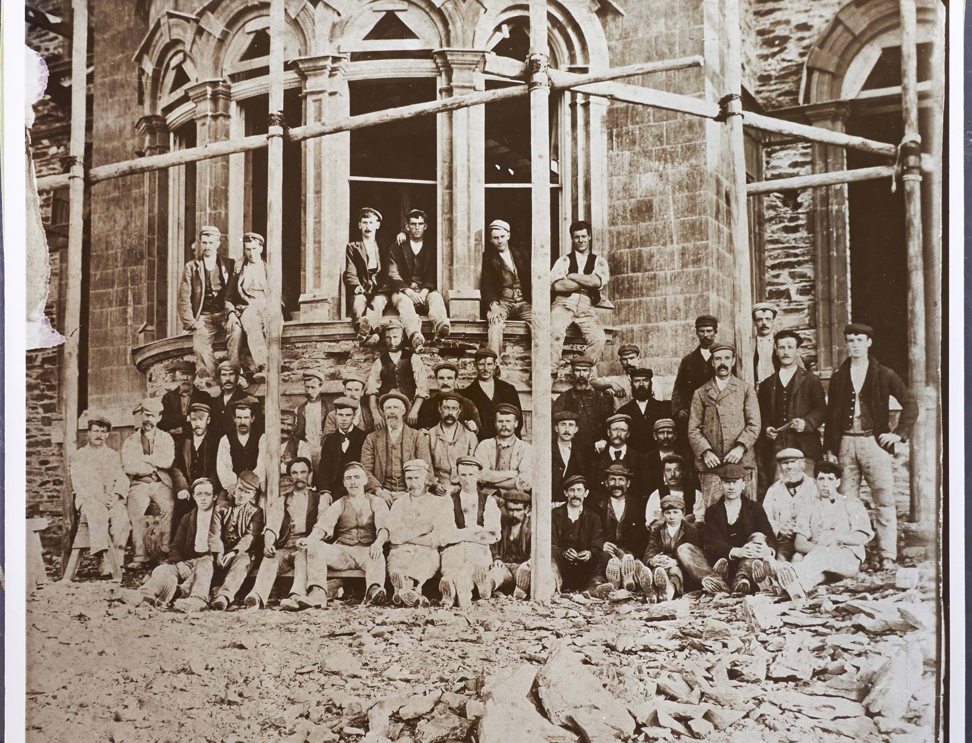 People standing in front of the hotel while it was being built