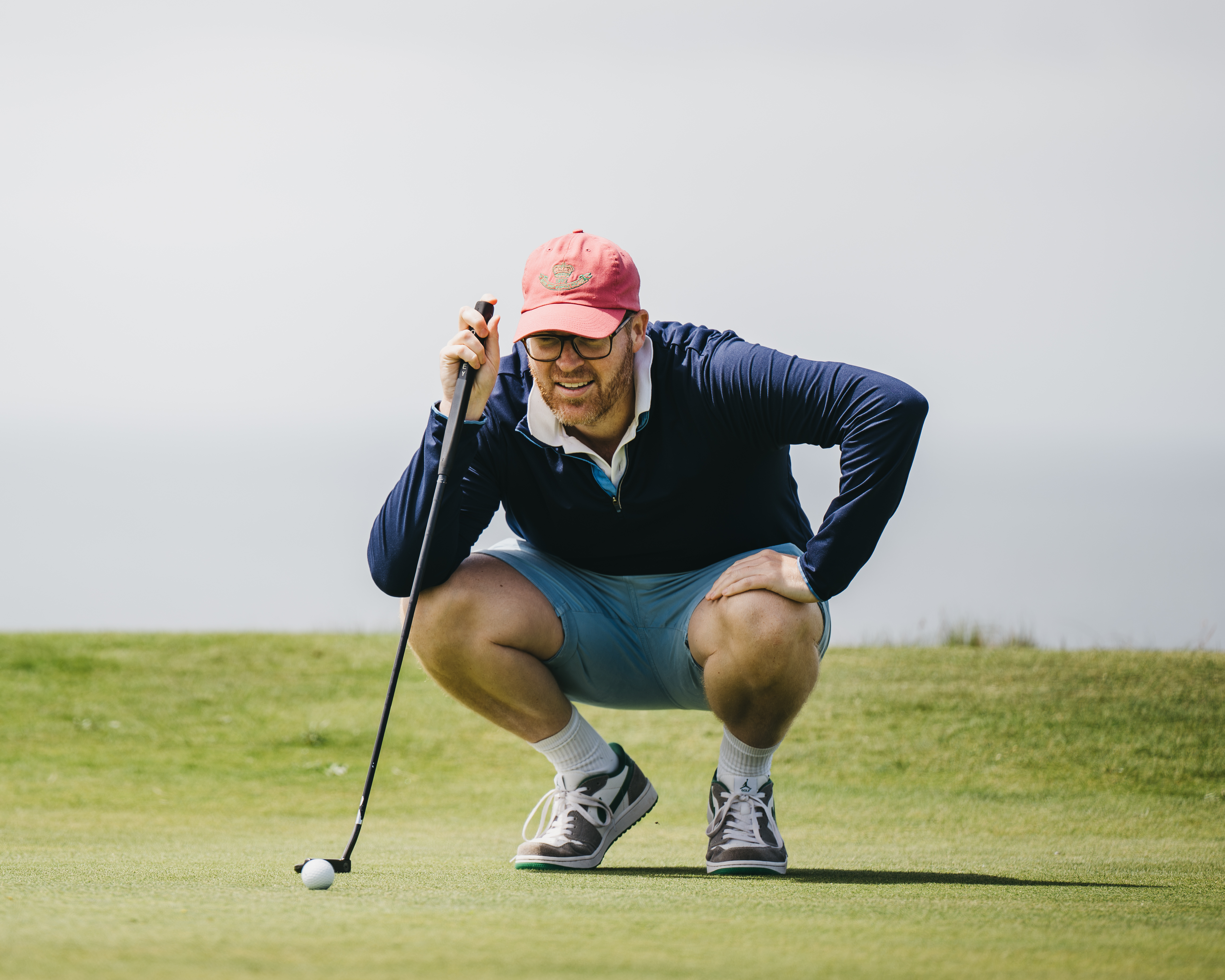 Man watching his golf ball