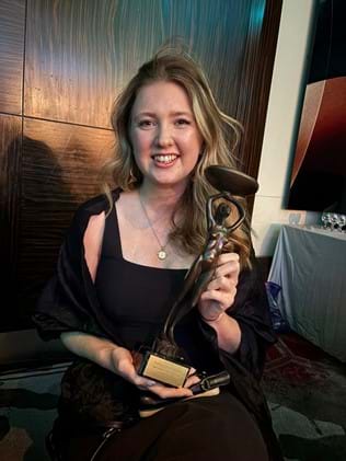 Beth celebrates with award