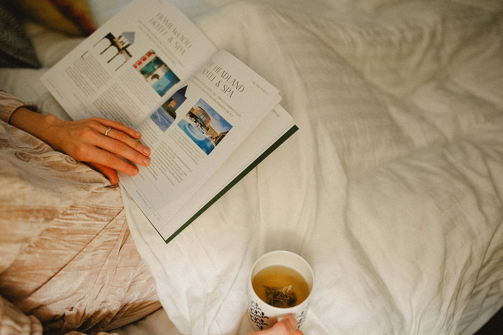 Tea and magazine in bed